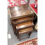 A good nest of four Chinese hardwood tables.