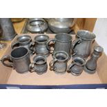 Pewter measures, tankards and other items.