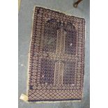 A small blue ground Persian prayer rug.