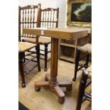 An unusual oak pedestal table with dished top.