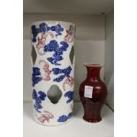 A Chinese under glazed blue and iron red porcelain hat stand and a sang de boeuf vase.