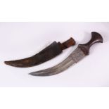 AN 18TH/19TH CENTURY INDIAN JAMBYIA, with steel hilt, the curving blade decorated with hunting