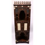 A LATE 19TH CENTURY MOORISH STANDING CORNER CABINET, profusely carved decoration, inlaid and inset