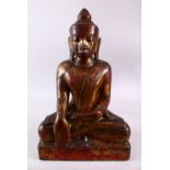 A FINE EARLY STONE THAI SEATED BUDDHA, in Bhumisparsha Mudra pose, with traces of red lacquer and