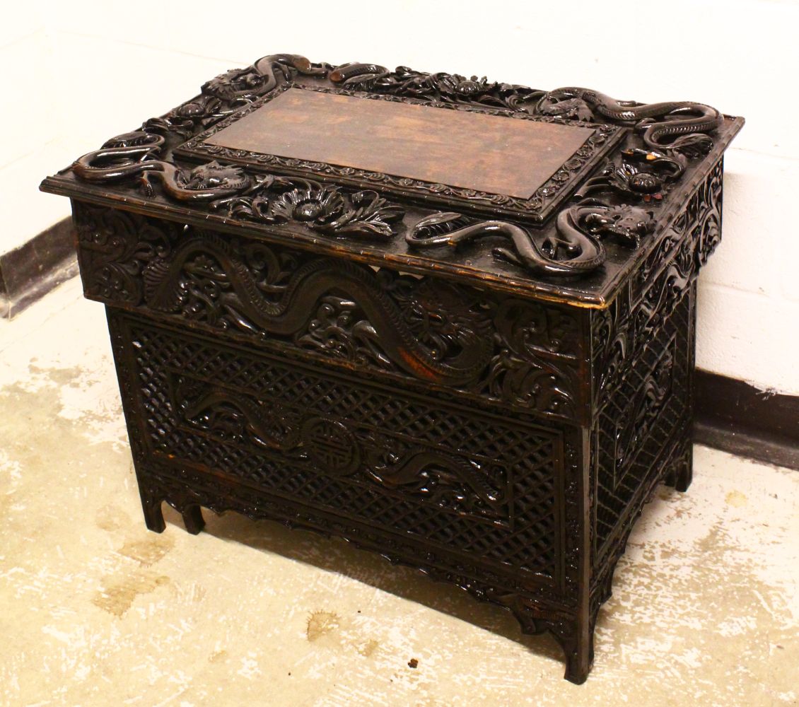 A 19TH CENTURY CHINESE / KASHMIR WALNUT TRAVELLING FOLDING TABLE, the top carved with dragons and