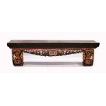 A LONG 17TH / 18TH CENTURY CHINESE ALTAR TABLE, the base carved and pierced with flowers and