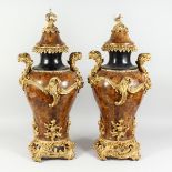 A GOOD PAIR OF LOUIS XVI DESIGN FAUX MARBLE ORMOLU MOUNTED, TWO HANDLED URNS AND COVERS, with