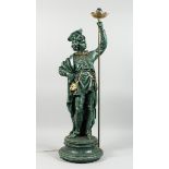 A COMPOSITION STANDING FIGURE OF A NOBLEMAN HOLDING A TORCH, 2 ft. 11 in. high.