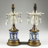 A GOOD PAIR OF WEDGWOOD BLUE AND WHITE LUSTRES with prism drops 11 ins high