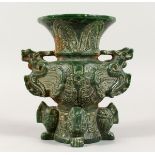 A CHINESE CARVED GREEN STONE ARCHAIC DRAGON VASE 7 ins, high