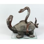 A BRONZE TURTLE being attacked by a snake 18 ins high.