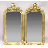 A PAIR OF GILT RECTANGULAR UPRIGHT MIRRORS with scroll decoration, 6 feet 2 inches high x 3 feet