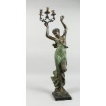 A CLASSICAL BRONZE FEMALE holding three scrolling candle branches on a square base, 2 ft. 8 in.