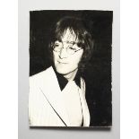 A SUSAN BLAKE PHOTOGRAPH OF JOHN LENNON at an art exhibition, given by his friend Jonathan Hague 7 x