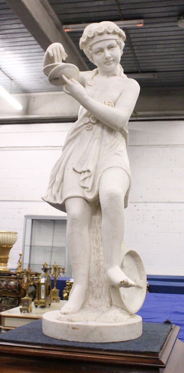 A GOOD LARGE ITALIAN CARVED CARRERA MARBLE, CHILD PERSONIFYING MUSIC, carved as a young female