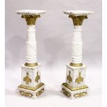 A GOOD PAIR OF WHITE VEINED MARBLE TORCHERES with squared tops, gilt Corinthian capitals and