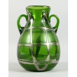 A GOOD LOETZ STYLE GREEN GLASS TWO HANDLED VASE with silver mounts, 10 in. high.