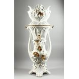 A LARGE POTTERY WHITE GILDED JARDINIERE AND STAND with gilt flowers, 3 ft 8 ins high.