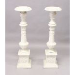 A GOOD PAIR OF VICTORIAN WHITE PAINTED CAST IRON STANDS, fluted columns on pedestal bases. 3ft