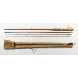 A FOUR PIECE SPLIT CANE FLY ROD, with cloth case.