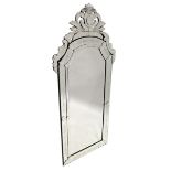 A LARGE VENETIAN MIRROR, bevelled glass in a scrolling mirror frame, 7 ft. 7 in. high, 3 ft. 6 in.