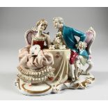 A CONTINENTAL PORCELAIN GROUP GALLANT AND LADY, 8 ins. high.