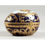 A PORCELAIN BLUE AND GILDED EGG, 8 in.