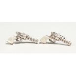 A PAIR OF SILVER AND MOTHER OF PEARL PISTOL CUFF LINKS