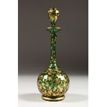 A BOHEMIAN GREEN AND GILT SCENT BOTTLE AND STOPPER. 7 ins high.