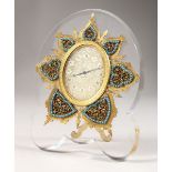 A SUPERB STRUTT CLOCK, on a shaped crystal frame, the oval dial with fine engraving, surrounded by