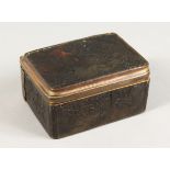 AN 18TH CENTURY TORTOISESHELL BOX AND COVER with musical trophies in relief. 3ins.