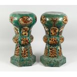 A PAIR OF CHINESE POTTERY GARDEN SEATS (one AF) 18 in. high.