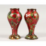 A SMALL PAIR OF 19TH CENTURY ENAMEL VASES. 4.5ins high.
