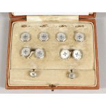 A SET OF PLATINUM AND MOTHER OF PEARL STUDS AND CUFF LINKS Goldsmith & Silversmith Co. Provenance: