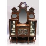 A VICTORIAN MAHOGANY STANDING CHINA CABINET the top with three mirrored panels, on a base with bow
