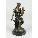 AFTER MOREAU, A TWO COLOURED BRONZE OF A CLASSICAL GIRL with winged cherub on a circular marble