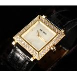 A VERY GOOD BOUCHERON 18CT GOLD DIAMOND SET WRISTWATCH with leather strap, No. AJ4103, in case