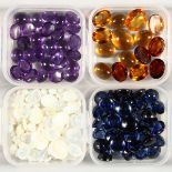 FOUR SMALL BOXES OF CABOCHON STONES