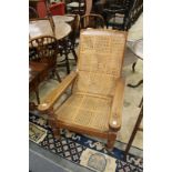 A teak plantation armchair.