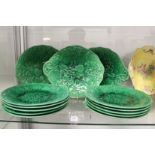 A quantity of green Majolica leaf moulded plates.