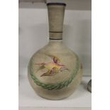 An unusual pottery hookah base or vase painted with flowers.