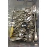 A large quantity of plated flatware to include forks and spoons.