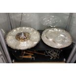 A silver plate and cut glass centrepiece and plated carving dish.