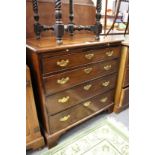 A George III mahogany four drawer chest with brushing slide.