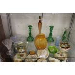 A Lalique moulded orange glass vase and other colourful glassware.