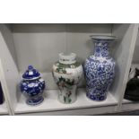 Two Chinese vases and a ginger jar and cover (AF).