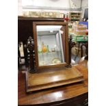 An oak dressing table mirror.