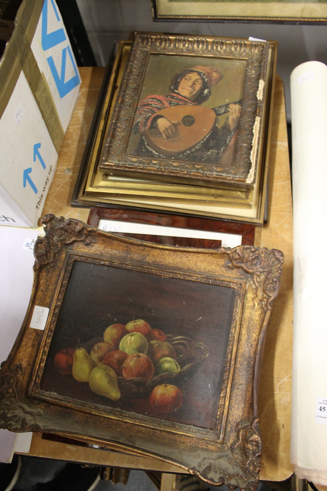 A still life of fruit in a basket, oil on board, and four other paintings.