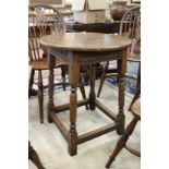 A small oak circular table.