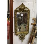 A good decorative cast brass framed wall mirror.